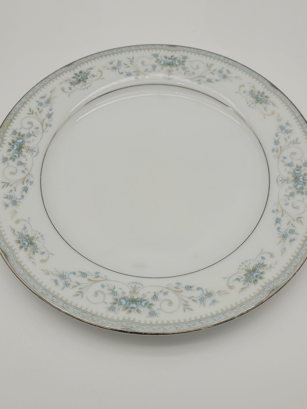 Noritake 6107 White Dinner Plate with Light Blue Floral and Gold Trim